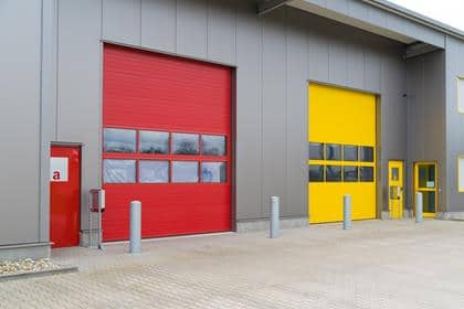 modern business units with red and yellow loading doors